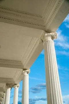 Columns on blue sky background. Stock Photos