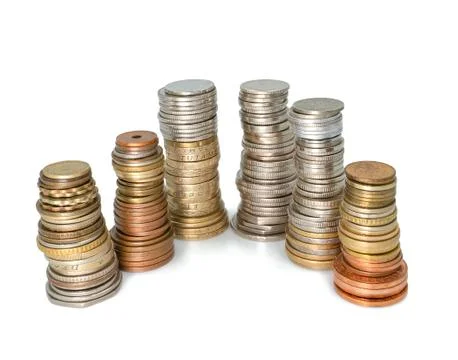 Columns of different coins stand next to each other on a white background Stock Photos