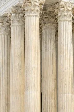 Columns fluted marble background texture. Columns repetition symmetry layou.. Stock Photos