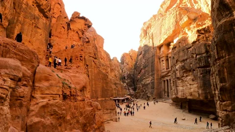 Columns of Great Treasury Temple of Petra and facades of tombs. Stock Footage 144060399