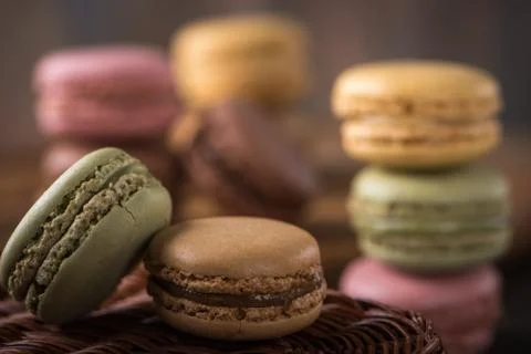 Columns with macaroons on wicker basket background Stock Photos