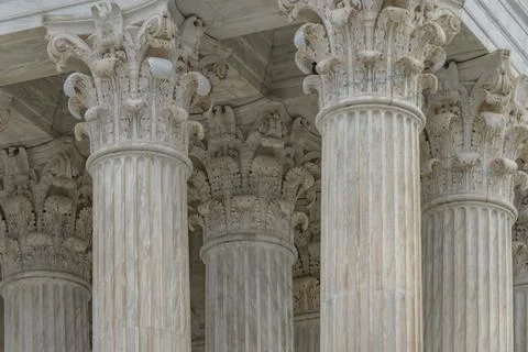 Columns marble Tall vertical facade. Columns architectural symmetry texture.. Stock Photos