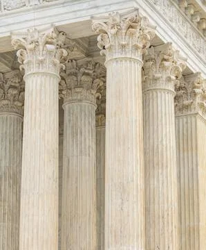 Columns marble Tall vertical perspective. Columns fluted symmetry pattern. .. Stock Photos