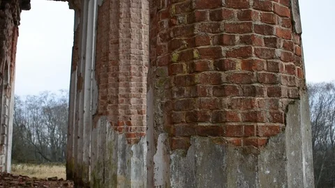 Columns of an old building with severely damaged plaster Stock Footage 122238486