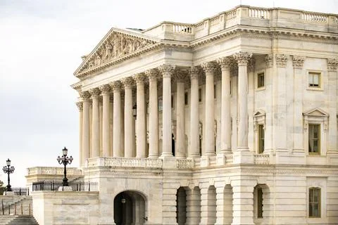 Columns stone facade architectural layout. Columns fluted marble repetition.. Stock Photos