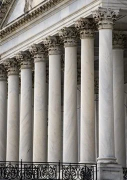 Columns stone Tall vertical marble. Columns architectural symmetry texture. C Fotos Stock