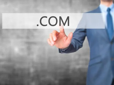 .COM - Businessman hand pressing button on touch screen interface. 库存照片