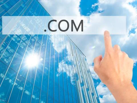 .COM - Hand pressing a button on blurred background concept on visual screen. 写真素材