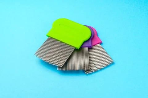 Comb for lice removing on blue background Foto stock