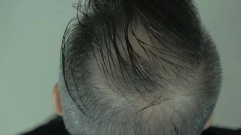 Comb Man coning hair, Stock Video Pond5