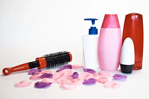 Comb, shampoo, liquid soap, aromatic bath leaves and other toiletries Stock Photos