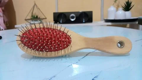 Comb on a white table Stock Photos