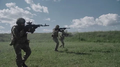 Combat actions. Armed special forces soldiers in a hot spot fire Stock Footage 327358823