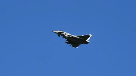 Combat aircraft in flight at low speed and high angle of attack in blue sky Stock Footage 168021168