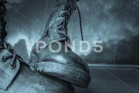 Combat boot on wooden Stock Photos