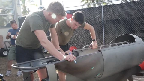 Combat drivers inspect diving propulsion device - 2014 Stock Footage 100875623