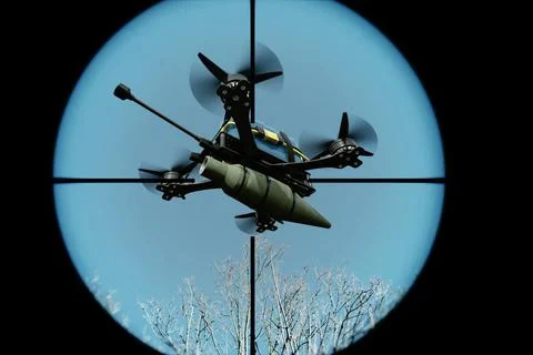 A combat drone with an explosive charge in the sky, shot through aiming optic 스톡 사진