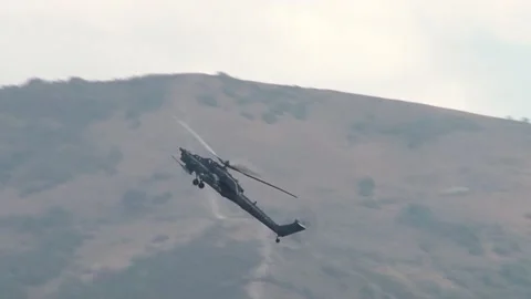 Combat helicopter Mi-28N, night hunter (NATO Havoc) flies over of Gelendzhik Bay Stock Footage 130731511