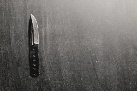 Combat knife blade on dark backround Stock Photos