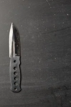 Combat knife blade on dark backround Stock Photos