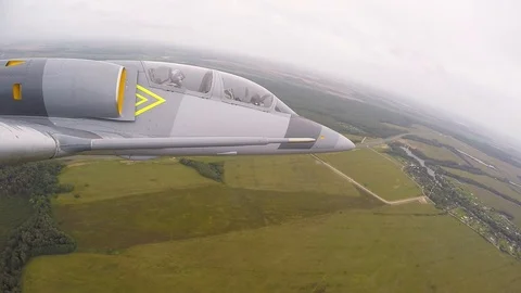 Combat plane heading for target. A fighter flies. View from right wing close up. Stock Footage 118676625