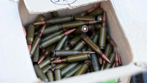 Combat Prep: Close-Up of Rifle Cartridges for Military Logistics &amp; Training in Stock Footage 311567981