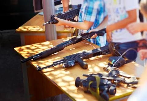 Combat weapons in the hands of children 스톡 사진