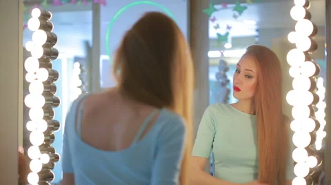 Combed woman in the mirror. She is going on a date. Stock Footage 63760617
