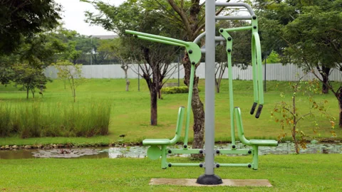 Combi pull-down challenger and power push machine in outdoor gym in the park Video stock 269538312