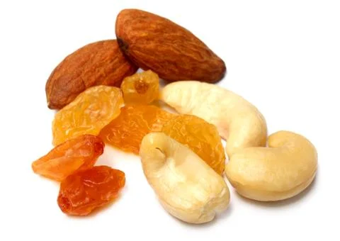 Combination of cashew nuts, almonds nuts and yellow raisins Stock Photos