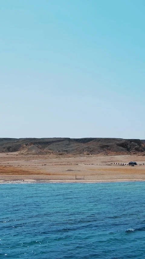 The combination of the desert and the sea. Summer, beautiful seascape. Mountains Stock Footage 308803897