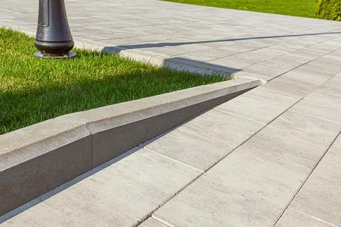 Combination of different levels of curbstone at the junction when paving. Stock Photos