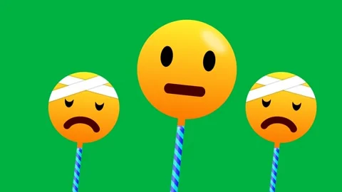 Combination of happy and bad day emoji in swinging motion isolated on green.. Stockbeeldmateriaal 270451116