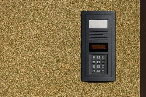 Combination lock control panel, intercom on the wall at the entrance to the.. 库存照片