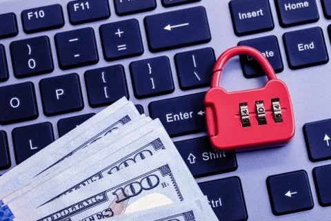 Combination lock with dollars on keyboard 写真素材