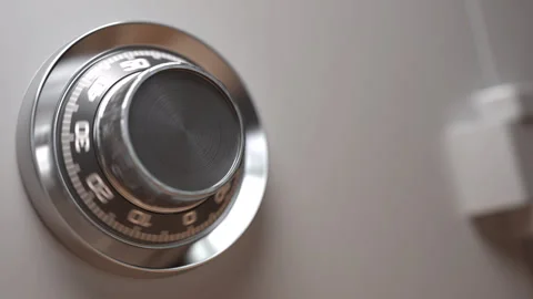 Combination lock on a opening safe door with pack of dollar banknotes inside it Video stock 260555065