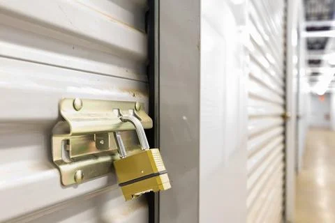 Combination lock on white self storage door Stock Photos