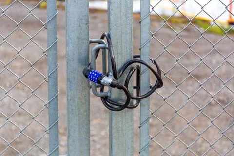 Combination Lock Wire Combination Lock Wire at Construction Site Barrier C... Stock Photos