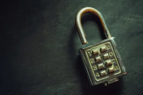 Combination padlock on blackboard background. Stock Photos