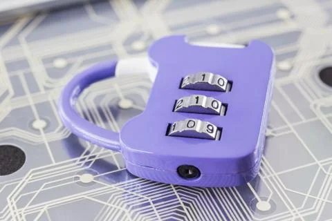 Combination padlock on digital circuits background. Stock Photos