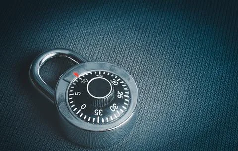 Combination padlock on texture black background. 写真素材