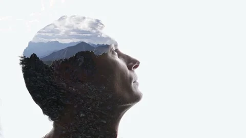 Combination of the silhouette of a man face and a landscape with mountains Stock Footage 285844461