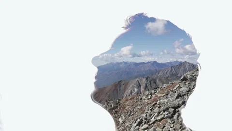 Combination of the silhouette of a man face and a landscape with mountains Stock Footage 285844486