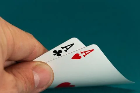 Combination of two different play cards in a hand Stock Photos