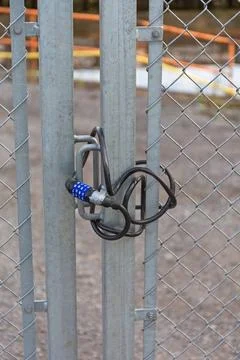 Combination Wire Lock Combination Lock Wire at Construction Site Barrier C... Stock Photos