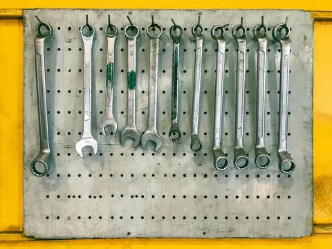 Combination wrenches on wall in garage Stock Photos