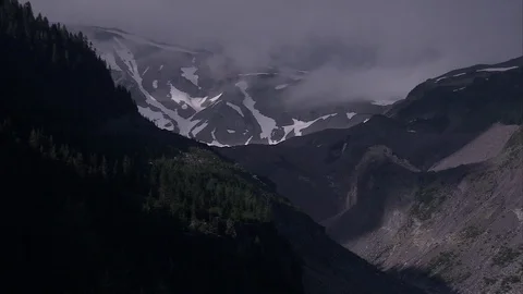 Combination zoom and pan shot, that reveals Mount Rainier canyon landscape Stock Footage 86755304