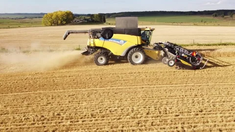 Combine finishing a final pass while harvesting during autumn. Stock Footage 274852551