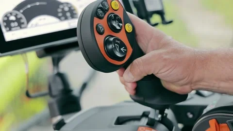 Combine harvester control joystick. The combine pulls the joystick lever towards Stock Footage 252201841