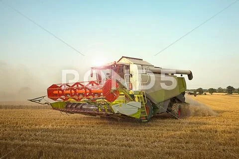 Combine Harvester In Field, Devon, England, Uk
